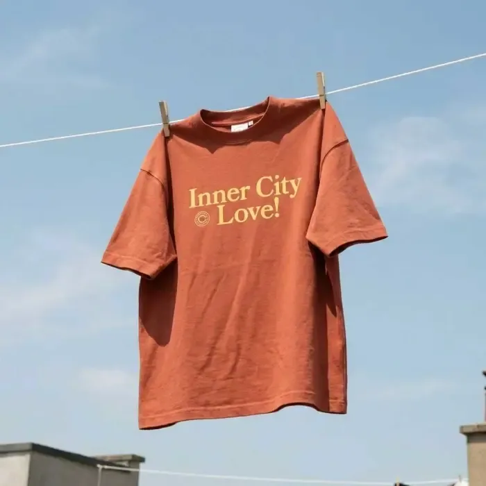 A printed orange shirt on a clothesline